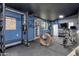 A home gym featuring fitness equipment, painted walls, and rubberized floor at 22039 N 86Th Ave, Peoria, AZ 85383