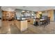 This kitchen features neutral cabinetry, black granite countertops, stainless steel appliances, and tile flooring at 22039 N 86Th Ave, Peoria, AZ 85383