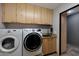 Convenient laundry room equipped with a washer, dryer, and sink at 22039 N 86Th Ave, Peoria, AZ 85383