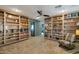 Living room with large bookshelves and a comfortable sitting area at 22039 N 86Th Ave, Peoria, AZ 85383
