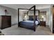 Bedroom with a four poster bed, with two nightstands, and a dresser at 22039 N 86Th Ave, Peoria, AZ 85383