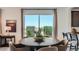 Elegant dining area featuring a stylish table, comfortable seating, and contemporary decor at 24643 N 164Th Dr, Surprise, AZ 85387