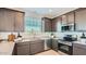 Well-equipped kitchen featuring stainless steel appliances and ample cabinet space at 24643 N 164Th Dr, Surprise, AZ 85387