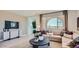 Well-lit living room featuring neutral tones, stylish furnishings, and an inviting atmosphere at 24643 N 164Th Dr, Surprise, AZ 85387