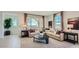 Bright living room showcasing large windows, comfortable seating, and an open concept design at 24643 N 164Th Dr, Surprise, AZ 85387