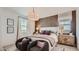 Comfortable main bedroom with textured wall and plenty of natural light at 24643 N 164Th Dr, Surprise, AZ 85387