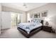 Serene bedroom featuring a plush bed, balcony access, and ample natural light for a comfortable living space at 2511 W Queen Creek Rd # 258, Chandler, AZ 85248
