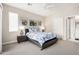 Cozy bedroom with bright, patterned bedding, natural light, and a neutral color scheme creating a serene retreat at 2511 W Queen Creek Rd # 258, Chandler, AZ 85248