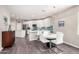 Dining area featuring a modern table set and a view into the bright, modern kitchen at 2511 W Queen Creek Rd # 258, Chandler, AZ 85248
