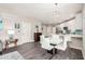 Well-lit dining area features a sleek table set and a view into the bright, modern kitchen at 2511 W Queen Creek Rd # 258, Chandler, AZ 85248