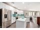View of the kitchen with stainless steel appliances, a center island, and stone countertops at 2511 W Queen Creek Rd # 258, Chandler, AZ 85248