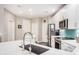 Spacious kitchen featuring stainless steel appliances, tile backsplash and white cabinets and island at 2511 W Queen Creek Rd # 258, Chandler, AZ 85248