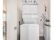 Convenient laundry area featuring a stacked washer and dryer set for efficient space utilization at 2511 W Queen Creek Rd # 258, Chandler, AZ 85248