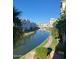 Beautiful water view with lush landscaping between buildings on a clear blue day at 2511 W Queen Creek Rd # 258, Chandler, AZ 85248
