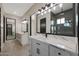 Luxury bathroom with double vanity, sleek fixtures, and walk-in shower offers a spa-like experience at 25846 W Denver Hill Dr, Wittmann, AZ 85361