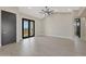 Spacious bedroom with tile floors and access to a private balcony with scenic views at 25846 W Denver Hill Dr, Wittmann, AZ 85361