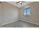 Bedroom featuring a ceiling fan and a large window offering an open view at 25846 W Denver Hill Dr, Wittmann, AZ 85361