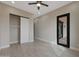 Spacious bedroom with ceiling fan, sliding glass door and closet with sliding door at 25846 W Denver Hill Dr, Wittmann, AZ 85361