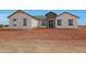 Charming single-story house with a neutral facade, a covered entry, and well-maintained landscaping at 25846 W Denver Hill Dr, Wittmann, AZ 85361