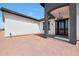 Well-designed home exterior with a covered porch, modern accents, and low-maintenance gravel yard at 25846 W Denver Hill Dr, Wittmann, AZ 85361