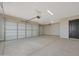 Spacious two-car garage with automatic doors and attached door to interior at 25846 W Denver Hill Dr, Wittmann, AZ 85361
