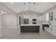 Bright, modern kitchen with white cabinets, stainless appliances, and a gray island with quartz countertops at 25846 W Denver Hill Dr, Wittmann, AZ 85361