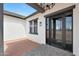 Covered patio area with sliding glass doors, offering a seamless transition between indoor and outdoor living at 25846 W Denver Hill Dr, Wittmann, AZ 85361