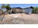 Backyard with a carport, gravel landscaping and block building at 2815 W Ohio St, Apache Junction, AZ 85120