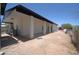 Backyard with a white-painted building and gravel landscaping at 2815 W Ohio St, Apache Junction, AZ 85120
