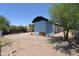 Backyard with a block building and gravel landscaping at 2815 W Ohio St, Apache Junction, AZ 85120