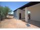 Backyard with a blue painted block building and gravel landscaping at 2815 W Ohio St, Apache Junction, AZ 85120
