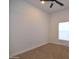 Bright bedroom featuring a ceiling fan and neutral colored carpet at 2815 W Ohio St, Apache Junction, AZ 85120