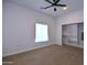 Bright, airy bedroom with plush carpet, ceiling fan, and closet space at 2815 W Ohio St, Apache Junction, AZ 85120