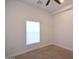Bedroom with neutral carpet and bright window with shades at 2815 W Ohio St, Apache Junction, AZ 85120