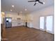 Modern kitchen featuring white cabinets, stainless steel appliances, and an open layout to the living area at 2815 W Ohio St, Apache Junction, AZ 85120