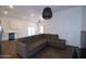 Open-concept floorplan features a living room, dining area, and modern kitchen with stainless steel appliances at 2815 W Ohio St, Apache Junction, AZ 85120