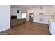 Open-concept living space featuring a modern kitchen, comfortable seating, and plenty of natural light at 2815 W Ohio St, Apache Junction, AZ 85120