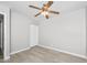 Bright bedroom with a ceiling fan, light-colored walls, a closet, and light-colored flooring at 286 W Palomino Dr # 147, Chandler, AZ 85225