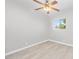 Comfortable bedroom featuring a ceiling fan, light-colored walls, and a bright window with natural light at 286 W Palomino Dr # 147, Chandler, AZ 85225
