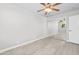 Well-lit bedroom with a ceiling fan, window, and a closet with mirrored sliding doors at 286 W Palomino Dr # 147, Chandler, AZ 85225