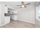 Updated kitchen with white cabinets, modern countertops, and stainless steel appliances at 286 W Palomino Dr # 147, Chandler, AZ 85225