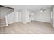 Bright living room features wood-look floors and a staircase leading to the second level at 286 W Palomino Dr # 147, Chandler, AZ 85225