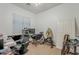 Bedroom features a ceiling fan, a window for natural light, and carpet flooring at 2976 E Clifton Ave, Gilbert, AZ 85295