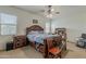 Bedroom with a large bed, two side tables, ceiling fan, and natural light from two windows at 2976 E Clifton Ave, Gilbert, AZ 85295