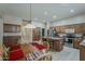 Open-concept kitchen connects to the dining area with ample storage, stainless appliances, and a functional island at 2976 E Clifton Ave, Gilbert, AZ 85295