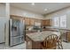 Well-equipped kitchen features stainless steel appliances, a center island, and ample cabinet space for storage at 2976 E Clifton Ave, Gilbert, AZ 85295