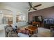 Cozy living room showcases an open layout with a ceiling fan, comfortable seating, and seamless access to the kitchen at 2976 E Clifton Ave, Gilbert, AZ 85295