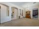 Inviting living space featuring neutral tones, arched doorways, and a decorative china cabinet for an open, airy feel at 2976 E Clifton Ave, Gilbert, AZ 85295