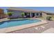 Backyard pool area with landscaping, patio, and a covered seating area at 2976 E Clifton Ave, Gilbert, AZ 85295