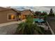 Relaxing backyard retreat with a refreshing pool, lounge chairs, and lush landscaping at 3018 E Vernon St, Gilbert, AZ 85298